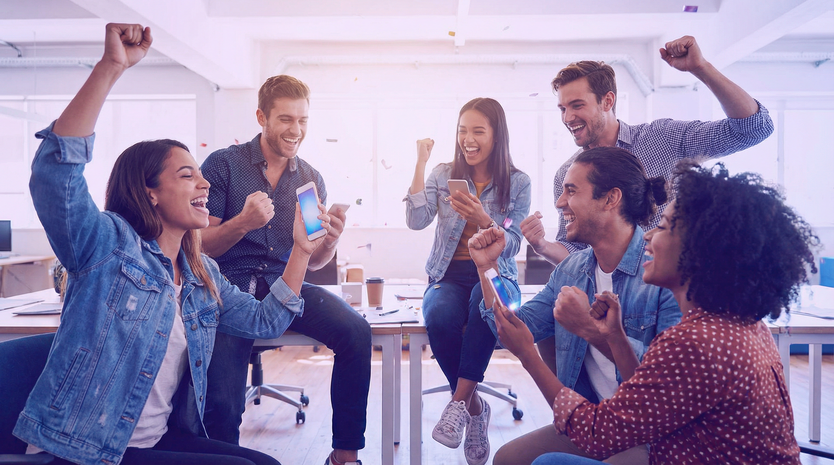 People celebrating success with smartphones